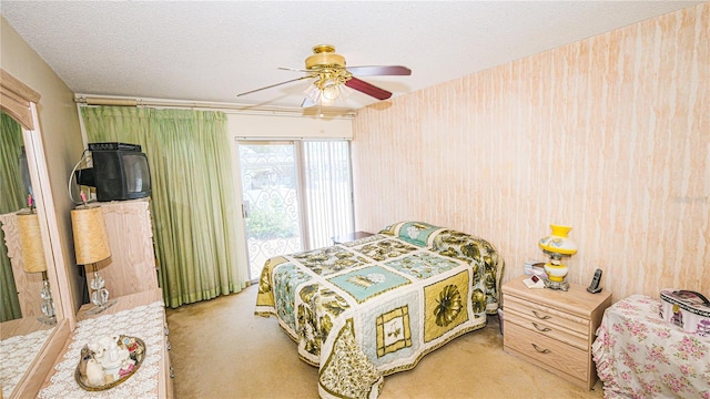 1655 S Highland Ave Unit F126, Clearwater, FL 33756 - bedroom with light carpet, a textured ceiling, and a ceiling fan