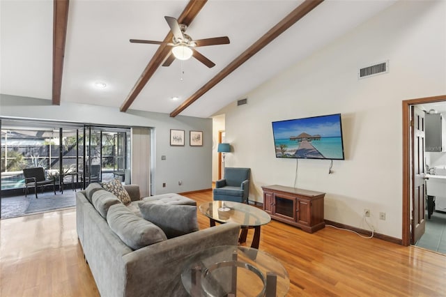 170 Foxfire Ln, Oldsmar, FL 34677 - living area featuring a ceiling fan, vaulted ceiling with beams, light wood-style flooring, baseboards, and visible vents