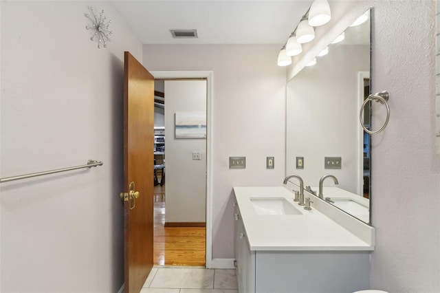 170 Foxfire Ln, Oldsmar, FL 34677 - bathroom featuring baseboards, visible vents, and vanity