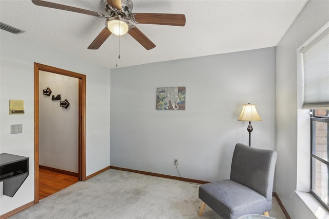 170 Foxfire Ln, Oldsmar, FL 34677 - sitting room featuring carpet floors, a ceiling fan, visible vents, and baseboards