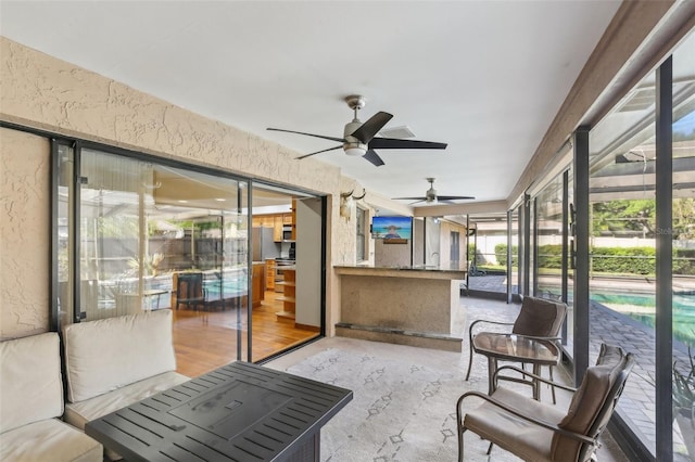 170 Foxfire Ln, Oldsmar, FL 34677 - sunroom with a ceiling fan and outdoor dry bar
