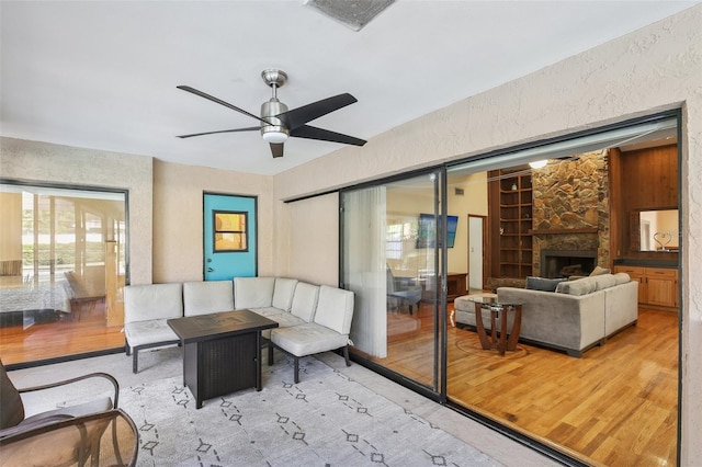 170 Foxfire Ln, Oldsmar, FL 34677 - view of patio with an outdoor living space with a fireplace, ceiling fan, and visible vents