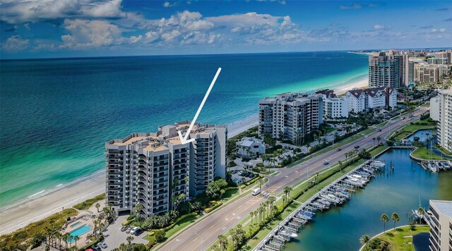 birds eye view of property featuring a water view and a city view