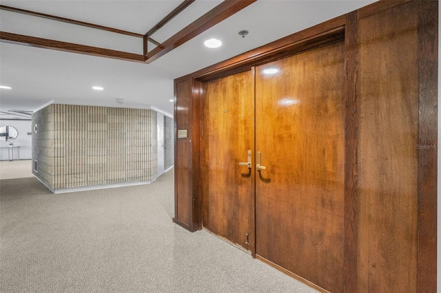 corridor featuring carpet flooring, ornamental molding, and recessed lighting