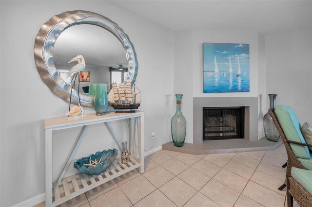 entrance foyer featuring tile patterned floors, a fireplace, and baseboards