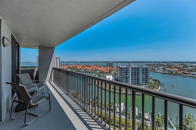 balcony featuring a water view