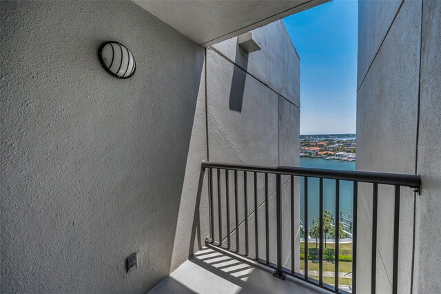 balcony featuring a water view