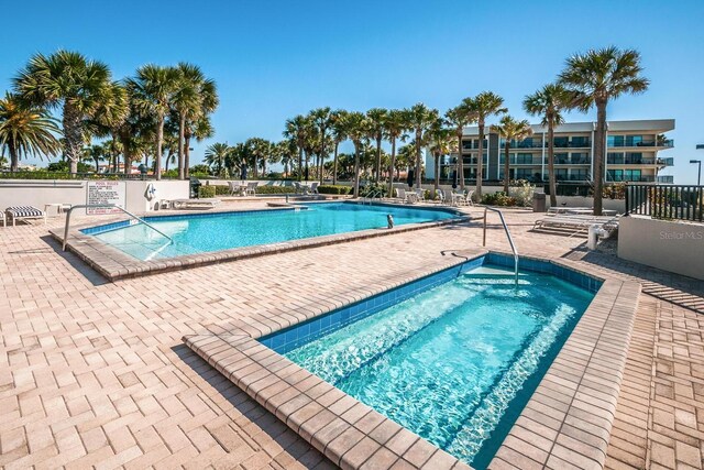 pool featuring a patio area