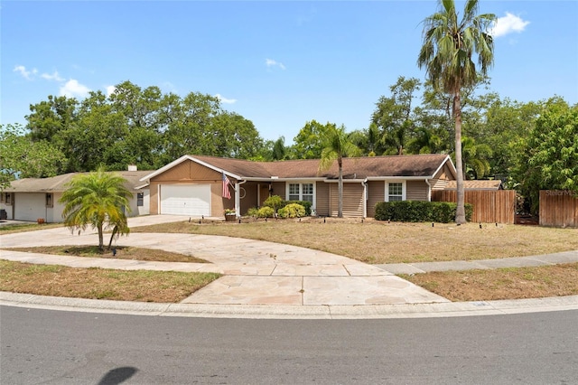 single story home with an attached garage and concrete driveway