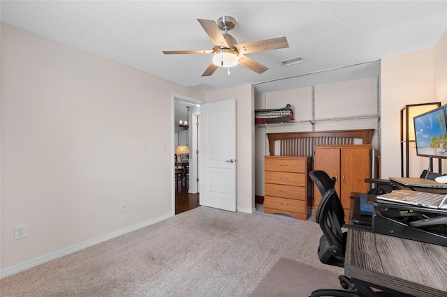 home office with carpet flooring, ceiling fan, and baseboards