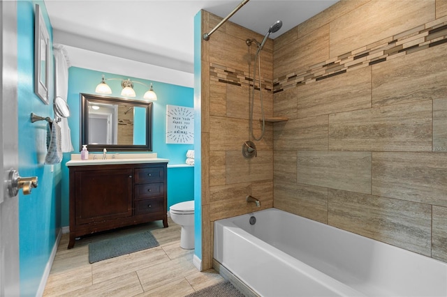 full bathroom with toilet, vanity, washtub / shower combination, and baseboards