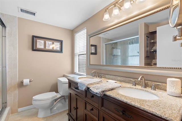 full bathroom with a stall shower, toilet, double vanity, tile patterned floors, and baseboards
