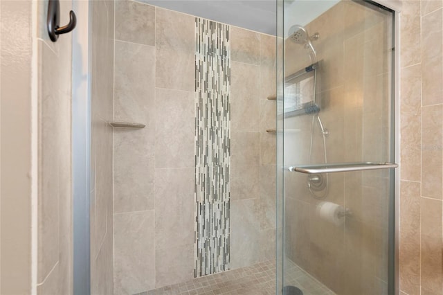 bathroom with a shower stall
