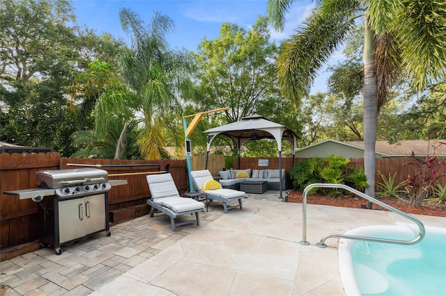 view of patio / terrace with an outdoor living space, a gazebo, a fenced backyard, and a grill