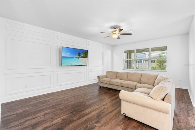 living room featuring a ceiling fan and dark wood finished floors