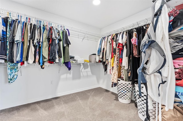 spacious closet with carpet flooring