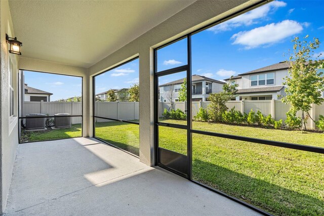 unfurnished sunroom featuring a residential view