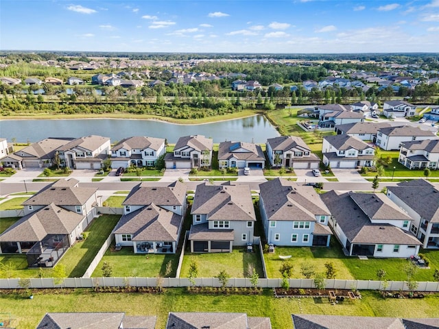 bird's eye view with a water view and a residential view