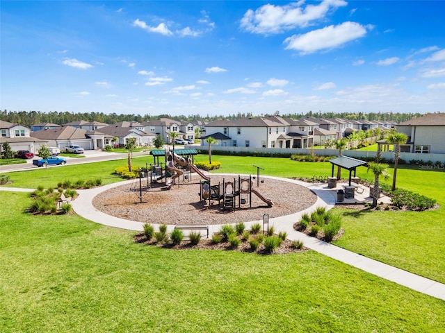 exterior space featuring a yard, playground community, and a residential view