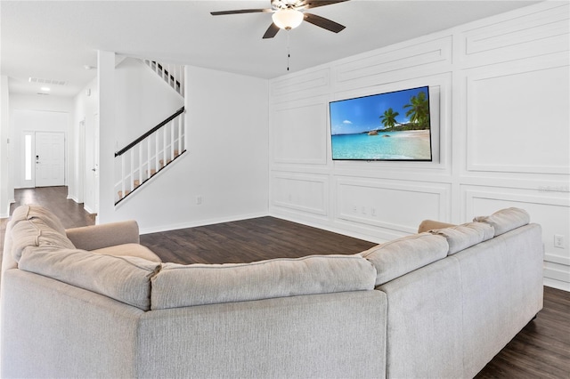 33263 Sycamore Leaf Dr, Wesley Chapel, FL 33545 - living room with dark wood-type flooring, stairway, ceiling fan, and baseboards