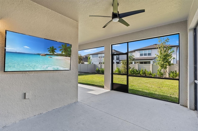 33263 Sycamore Leaf Dr, Wesley Chapel, FL 33545 - unfurnished sunroom featuring ceiling fan and a residential view