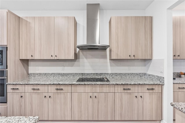 33263 Sycamore Leaf Dr, Wesley Chapel, FL 33545 - kitchen with light brown cabinets, wall chimney range hood, stainless steel appliances, tasteful backsplash, and light stone countertops