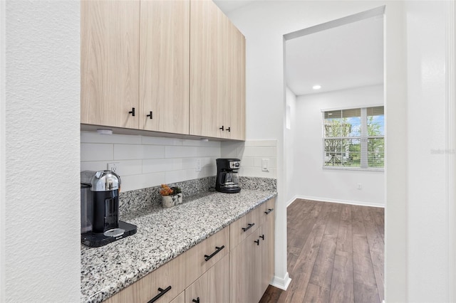 33263 Sycamore Leaf Dr, Wesley Chapel, FL 33545 - kitchen featuring light brown cabinets, light stone counters, backsplash, dark wood finished floors, and recessed lighting
