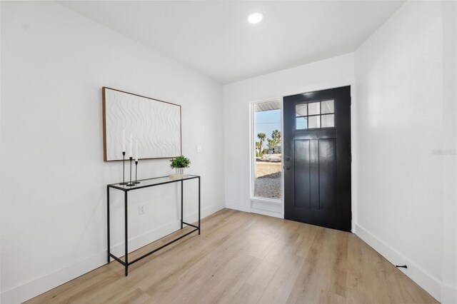 9920 Spoonbill Rd E, Bradenton, FL 34209 - entryway with wood finished floors, baseboards, and recessed lighting