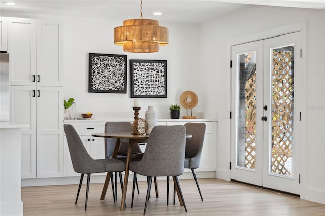 9920 Spoonbill Rd E, Bradenton, FL 34209 - dining space featuring light wood-type flooring, plenty of natural light, recessed lighting, and french doors