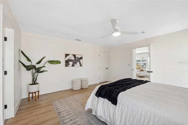9920 Spoonbill Rd E, Bradenton, FL 34209 - bedroom featuring light wood-style flooring, baseboards, and ceiling fan