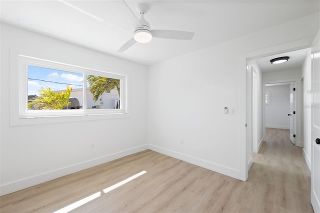 9920 Spoonbill Rd E, Bradenton, FL 34209 - empty room featuring light wood-style floors, baseboards, and a ceiling fan