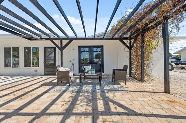 9920 Spoonbill Rd E, Bradenton, FL 34209 - view of patio / terrace featuring french doors and a pergola