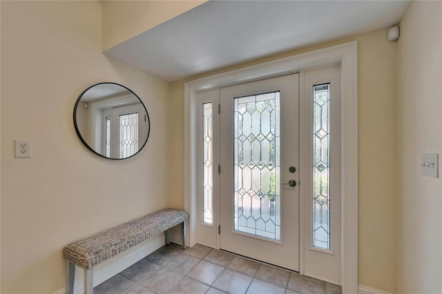 6451 Sunset Bay Cir, Apollo Beach, FL 33572 - foyer with baseboards and light tile patterned flooring