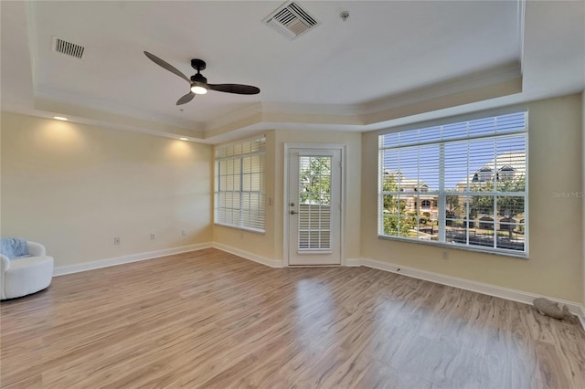 6451 Sunset Bay Cir, Apollo Beach, FL 33572 - spare room featuring a raised ceiling, crown molding, and visible vents