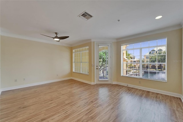 6451 Sunset Bay Cir, Apollo Beach, FL 33572 - unfurnished room with light wood-style flooring, ceiling fan, ornamental molding, and visible vents