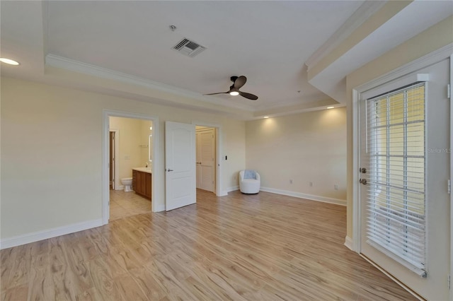 6451 Sunset Bay Cir, Apollo Beach, FL 33572 - unfurnished bedroom with crown molding, light wood-type flooring, recessed lighting, a raised ceiling, and baseboards