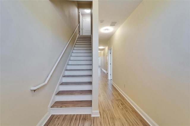 6451 Sunset Bay Cir, Apollo Beach, FL 33572 - stairway featuring visible vents, baseboards, and wood finished floors
