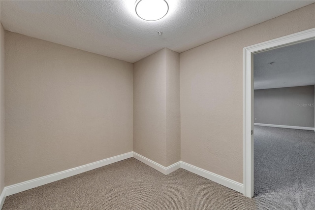6451 Sunset Bay Cir, Apollo Beach, FL 33572 - empty room featuring a textured ceiling, baseboards, and carpet