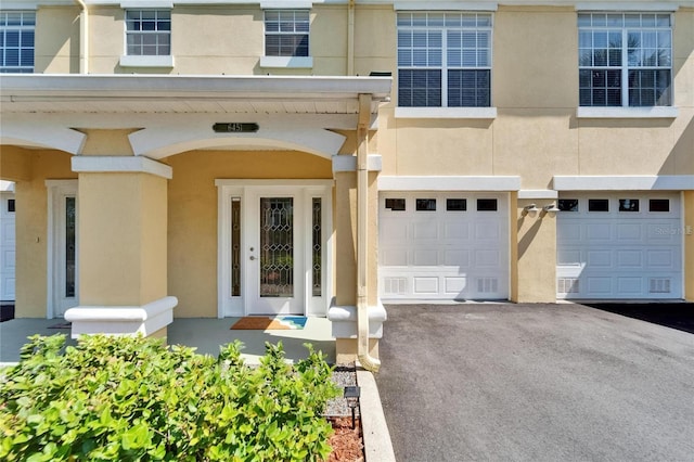 6451 Sunset Bay Cir, Apollo Beach, FL 33572 - entrance to property featuring driveway, stucco siding, and an attached garage