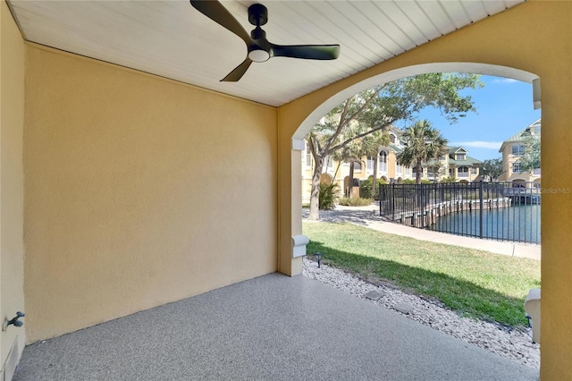 6451 Sunset Bay Cir, Apollo Beach, FL 33572 - view of patio with ceiling fan, fence, a residential view, and a water view