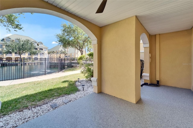 6451 Sunset Bay Cir, Apollo Beach, FL 33572 - view of patio / terrace with ceiling fan, fence, and a water view