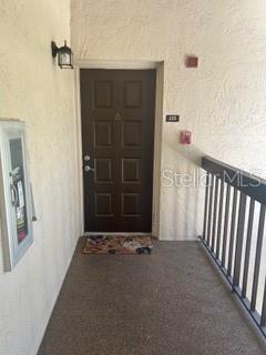 entrance to property with stucco siding