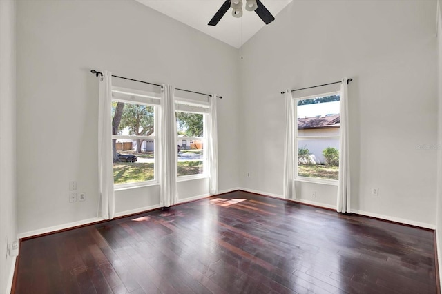 9603 Sunnyoak Dr, Riverview, FL 33569 - empty room featuring baseboards, a towering ceiling, hardwood / wood-style flooring, and ceiling fan