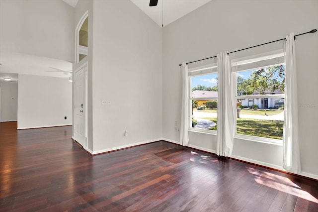 9603 Sunnyoak Dr, Riverview, FL 33569 - unfurnished room with baseboards, a ceiling fan, wood finished floors, and high vaulted ceiling
