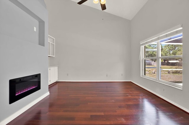 9603 Sunnyoak Dr, Riverview, FL 33569 - unfurnished living room featuring a glass covered fireplace, wood finished floors, high vaulted ceiling, and ceiling fan