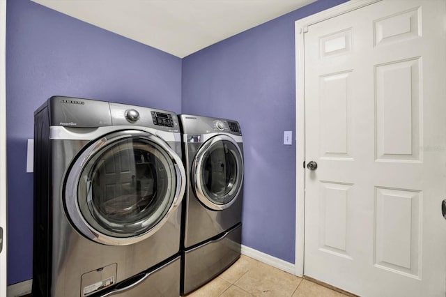 9603 Sunnyoak Dr, Riverview, FL 33569 - clothes washing area featuring washer and dryer, baseboards, light tile patterned flooring, and laundry area