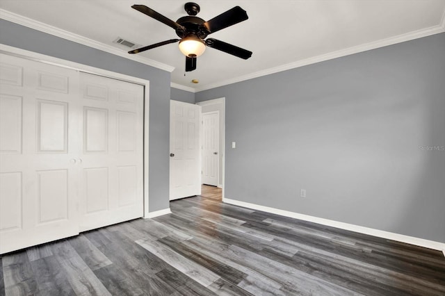 9603 Sunnyoak Dr, Riverview, FL 33569 - unfurnished bedroom with dark wood-style floors, baseboards, visible vents, a closet, and ornamental molding