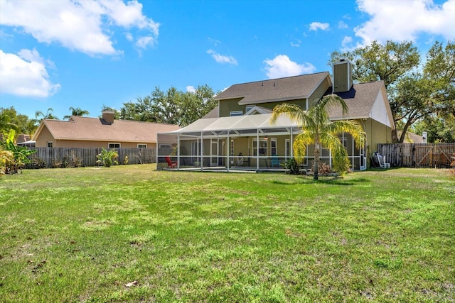 9603 Sunnyoak Dr, Riverview, FL 33569 - rear view of house with central air condition unit, a chimney, a lawn, a fenced backyard, and a lanai