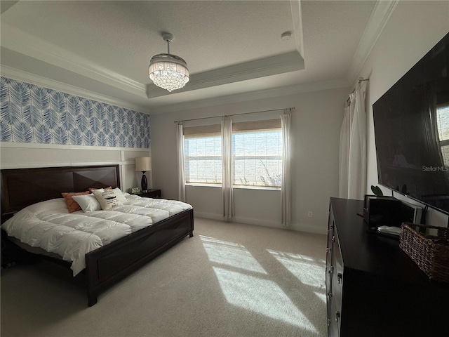bedroom featuring a chandelier, a raised ceiling, wallpapered walls, light carpet, and crown molding