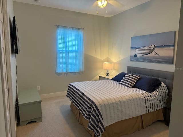 bedroom featuring carpet flooring, baseboards, and a ceiling fan
